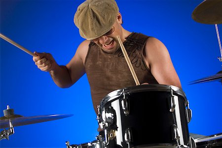 picture of the blue playing a instruments - Male drummer playing drums Stock Photo - Premium Royalty-Free, Code: 625-01743976