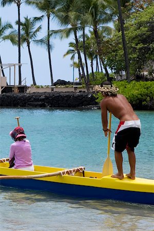 Rear view of a man and a woman canoeing in the sea, Captain Cook's Monument, Kealakekua Bay, Kona Coast, Big Island, Hawaii Stock Photo - Premium Royalty-Free, Code: 625-01751177