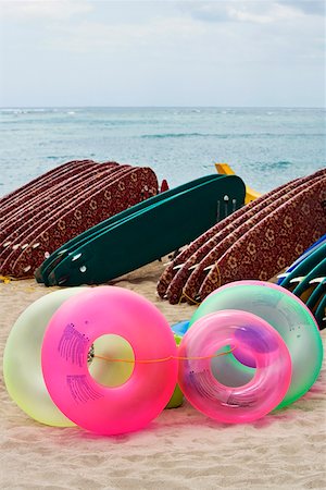simsearch:625-00903103,k - Inflatable rings and surfboards on the beach, Waikiki Beach, Honolulu, Oahu, Hawaii Islands, USA Stock Photo - Premium Royalty-Free, Code: 625-01751257