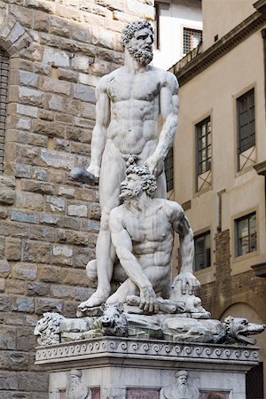 simsearch:625-01751332,k - Naked statues in front of a brick wall, Hercules and Caco, Piazza della Signoria, Florence, Italy Stock Photo - Premium Royalty-Free, Code: 625-01751354