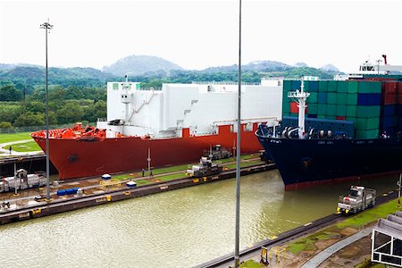 panama canal shipping - Container ships at a commercial dock, Panama Canal, Panama Stock Photo - Premium Royalty-Free, Code: 625-01751675