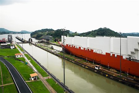 panama canal shipping - Container ship at a commercial dock, Panama Canal, Panama Stock Photo - Premium Royalty-Free, Code: 625-01751679