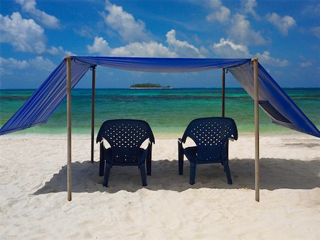 san andres - Empty chairs under the tent on the beach, Spratt Bight Beach, San Andres, Providencia y Santa Catalina, San Andres y Stock Photo - Premium Royalty-Free, Code: 625-01751808