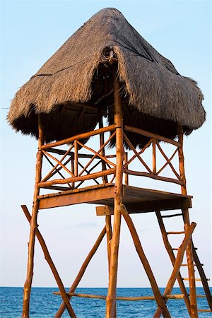 simsearch:625-00903103,k - Low angle view of a man sitting on a lifeguard hut, Cancun, Mexico Stock Photo - Premium Royalty-Free, Code: 625-01751893