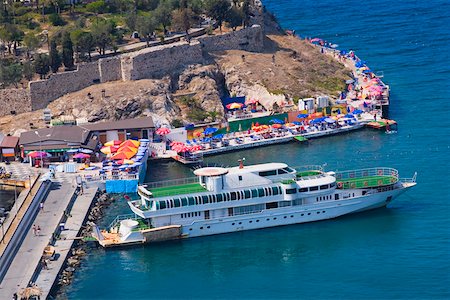person cruise ship - High angle view of a cruise ship moored at a harbor on an island, Ephesus, Turkey Stock Photo - Premium Royalty-Free, Code: 625-01752156