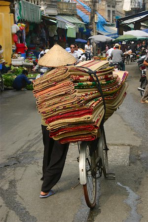 simsearch:630-03479347,k - Rear view of a man selling rugs in a market, Hanoi, Vietnam Stock Photo - Premium Royalty-Free, Code: 625-01753106