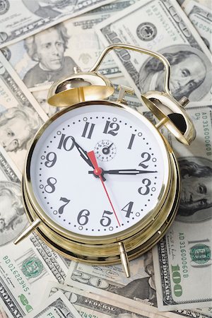 simsearch:625-00801281,k - Close-up of an alarm clock on paper currency Stock Photo - Premium Royalty-Free, Code: 625-02266034