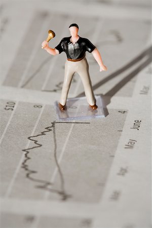 financial strategy - Figurine of a manual worker on a financial newspaper Stock Photo - Premium Royalty-Free, Code: 625-02266071