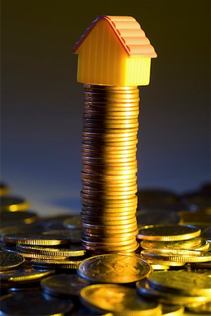 Model home on a stack of coins Stock Photo - Premium Royalty-Free, Code: 625-02266088
