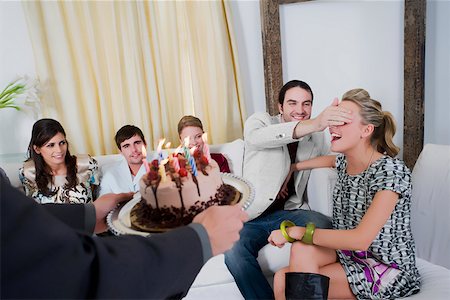 simsearch:625-01250196,k - Young woman celebrating a birthday party with her friends Stock Photo - Premium Royalty-Free, Code: 625-02266667