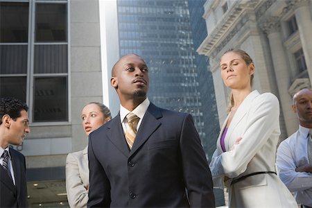 eyes looking away - Two businesswomen standing with three businessmen Stock Photo - Premium Royalty-Free, Code: 625-02266881