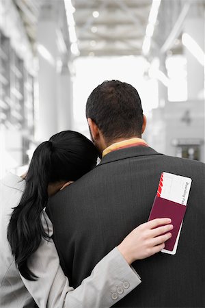 simsearch:625-02929600,k - Rear view of a businesswoman with her head on a businessman's shoulder Stock Photo - Premium Royalty-Free, Code: 625-02266926