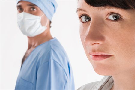 simsearch:625-02929180,k - Portrait of a female doctor with a male surgeon Stock Photo - Premium Royalty-Free, Code: 625-02267265