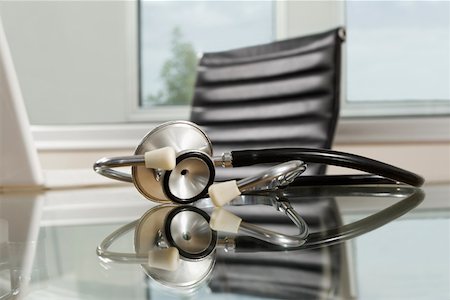 still life of stethoscope - Stethoscope on a table in a clinic Stock Photo - Premium Royalty-Free, Code: 625-02267263