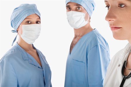simsearch:625-02929180,k - Close-up of a female doctor with two surgeons Stock Photo - Premium Royalty-Free, Code: 625-02267278