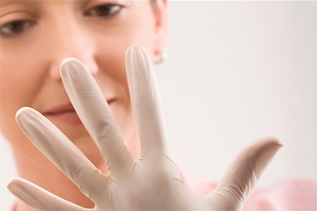simsearch:625-02929180,k - Female doctor wearing a surgical glove Stock Photo - Premium Royalty-Free, Code: 625-02267280