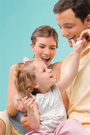 simsearch:625-02929316,k - Mid adult couple playing with their daughter Stock Photo - Premium Royalty-Free, Code: 625-02267377