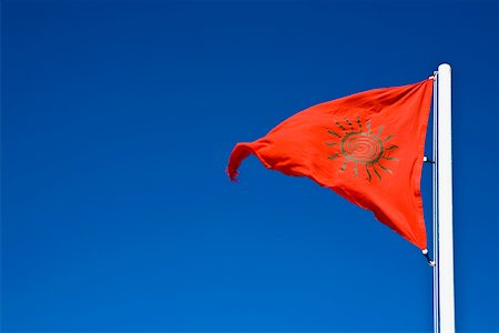 red flag - Low angle view of a flag fluttering, Tulum, Quintan Roo, Mexico Stock Photo - Premium Royalty-Free, Code: 625-02267915