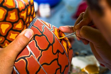 simsearch:700-03456784,k - Close-up of a person's hand painting on a ceramics, Arrazola, Oaxaca State, Mexico Stock Photo - Premium Royalty-Free, Code: 625-02267963