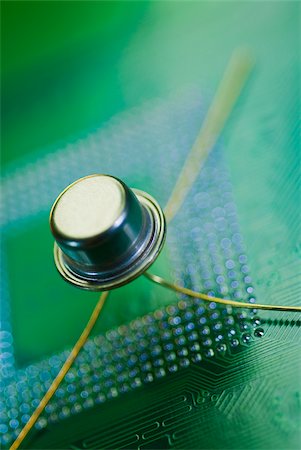 Close-up of a transistor on a mother board Stock Photo - Premium Royalty-Free, Code: 625-02926596