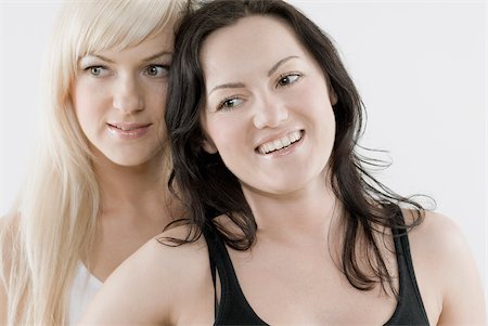 sensual gay - Close-up of a female homosexual couple smiling Stock Photo - Premium Royalty-Free, Code: 625-02927267