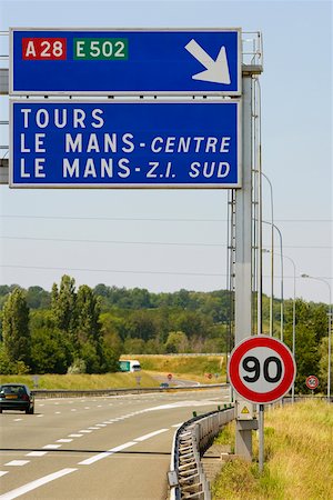 direction sign and nobody road - Car moving on the road, Le Mans, France Stock Photo - Premium Royalty-Free, Code: 625-02928087
