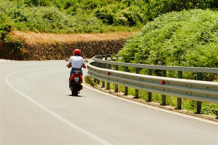 scooter rear view - Rear view of a man riding a motor scooter, Siena Province, Tuscany, Italy Stock Photo - Premium Royalty-Free, Code: 625-02928485