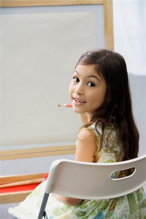 simsearch:614-06895765,k - Portrait of a schoolgirl sitting on a chair and painting in an art class Stock Photo - Premium Royalty-Free, Code: 625-02928956