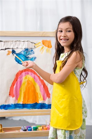 simsearch:614-06895765,k - Side profile of a schoolgirl painting in an art class and smiling Stock Photo - Premium Royalty-Free, Code: 625-02928958