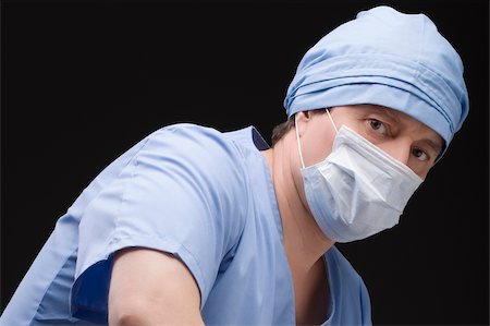 simsearch:625-02929180,k - Close-up of a male surgeon wearing scrubs and a surgical mask Stock Photo - Premium Royalty-Free, Code: 625-02929176