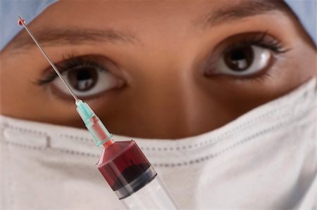 simsearch:625-02929180,k - Close-up of a female doctor with a syringe Stock Photo - Premium Royalty-Free, Code: 625-02929173
