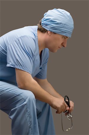 simsearch:625-02929180,k - Side profile of a male doctor thinking Stock Photo - Premium Royalty-Free, Code: 625-02929204
