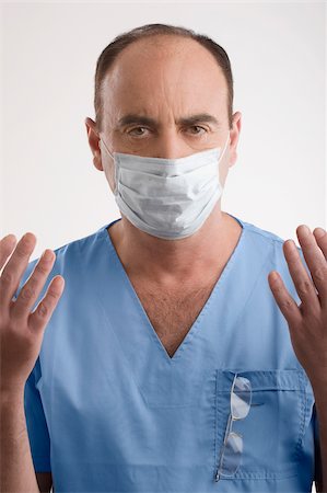 simsearch:625-02929180,k - Portrait of a male surgeon with his arms raised Stock Photo - Premium Royalty-Free, Code: 625-02929209