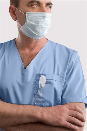 simsearch:625-02929180,k - Male surgeon wearing a surgical mask Stock Photo - Premium Royalty-Free, Code: 625-02929235