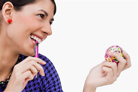 Close-up of a young woman holding rubber bands and smiling Foto de stock - Sin royalties Premium, Código: 625-02929405