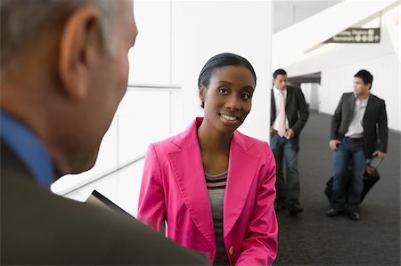 simsearch:625-02929600,k - Four business executives at an airport Stock Photo - Premium Royalty-Free, Code: 625-02929629