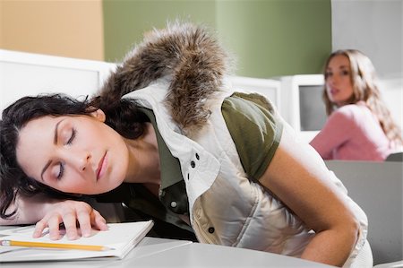 Young woman napping on a desk Stock Photo - Premium Royalty-Free, Code: 625-02929688