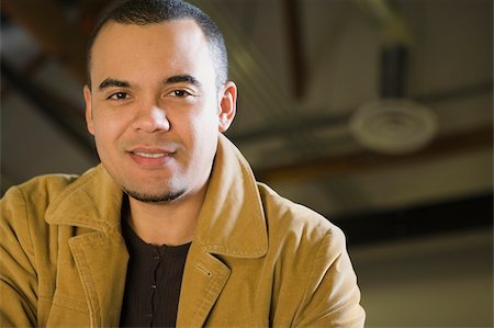 Portrait of a young man smiling Stock Photo - Premium Royalty-Free, Code: 625-02929826