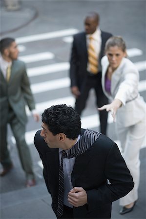 diversity executive - High angle view of business executives chasing a businessman Stock Photo - Premium Royalty-Free, Code: 625-02929953