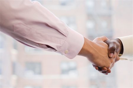 Close-up of two businessmen shaking hands Stock Photo - Premium Royalty-Free, Code: 625-02930171