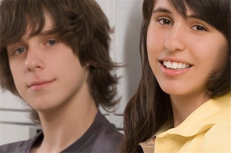 Portrait of a teenage boy and a teenage girl smiling Stock Photo - Premium Royalty-Free, Code: 625-02930346