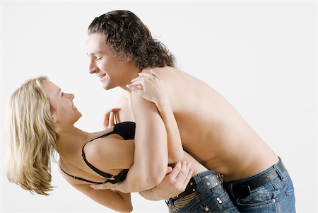 simsearch:625-02930669,k - Side profile of a young couple romancing Stock Photo - Premium Royalty-Free, Code: 625-02930646