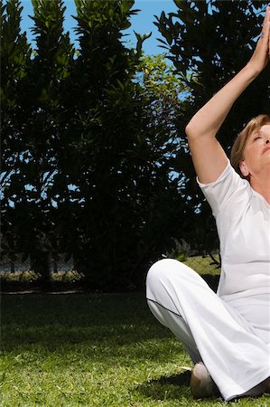 Senior woman practicing yoga Stock Photo - Premium Royalty-Free, Code: 625-02931049