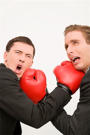 energy battle - Side profile of two businessmen boxing Stock Photo - Premium Royalty-Free, Code: 625-02931246