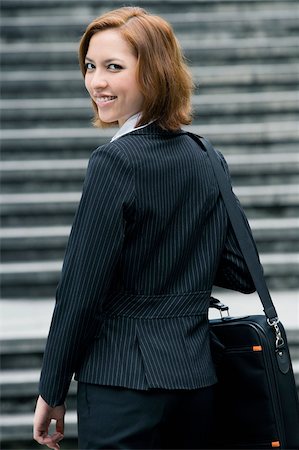simsearch:625-02931998,k - Portrait of a businesswoman carrying a shoulder bag Stock Photo - Premium Royalty-Free, Code: 625-02931719