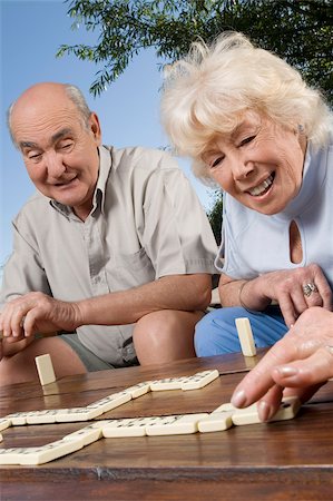 Senior couple playing dice game Stock Photo - Premium Royalty-Free, Code: 625-02931871