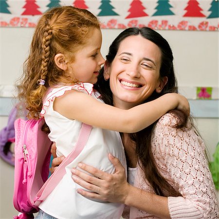 private school - Side profile of a girl whispering to her teacher Foto de stock - Sin royalties Premium, Código: 625-02932129