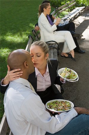 simsearch:625-02929600,k - Businesswoman kissing a businessman with two business executives sitting in the background Stock Photo - Premium Royalty-Free, Code: 625-02932217