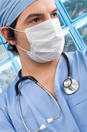 simsearch:625-02929180,k - Close-up of a male surgeon wearing a surgical mask Stock Photo - Premium Royalty-Free, Code: 625-02932276