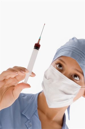 simsearch:625-02929180,k - Close-up of a female surgeon holding a syringe Stock Photo - Premium Royalty-Free, Code: 625-02932314
